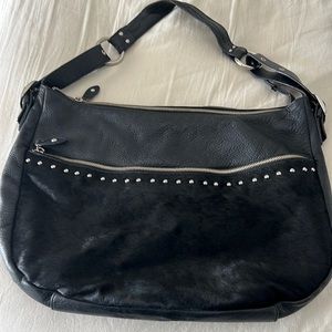 Aqua Madonna black leather fur bag.